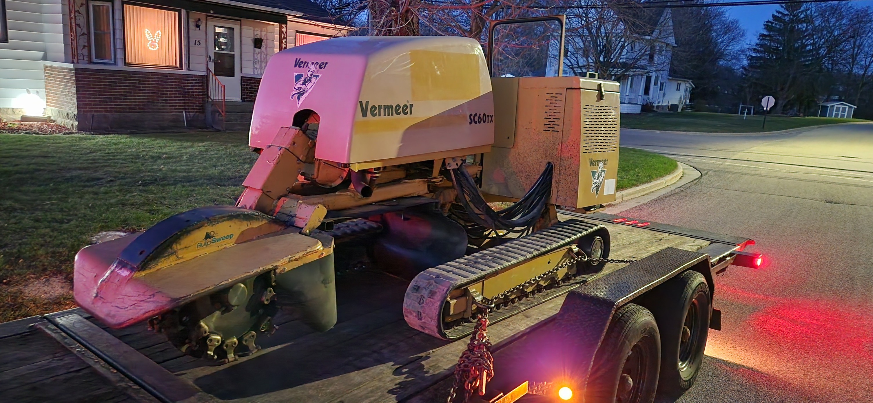 Tracked stump grinder mid-job